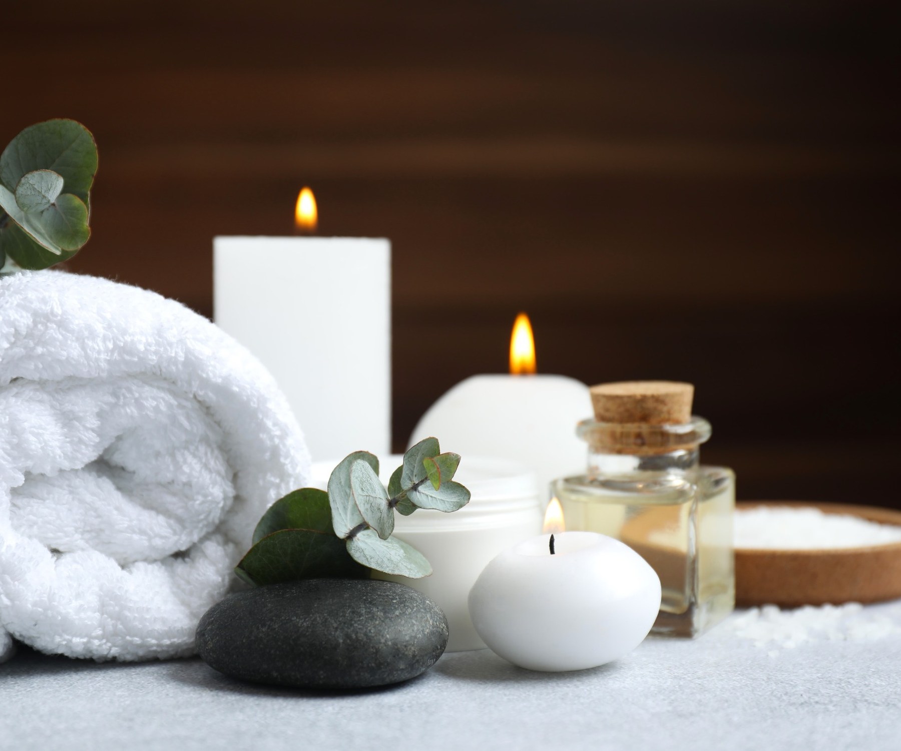 Wellness arrangement with towels, candles and cosmetic products for hotel and spa